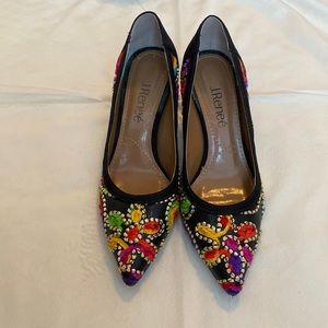 Hand stitched multi-color pattern black heels.